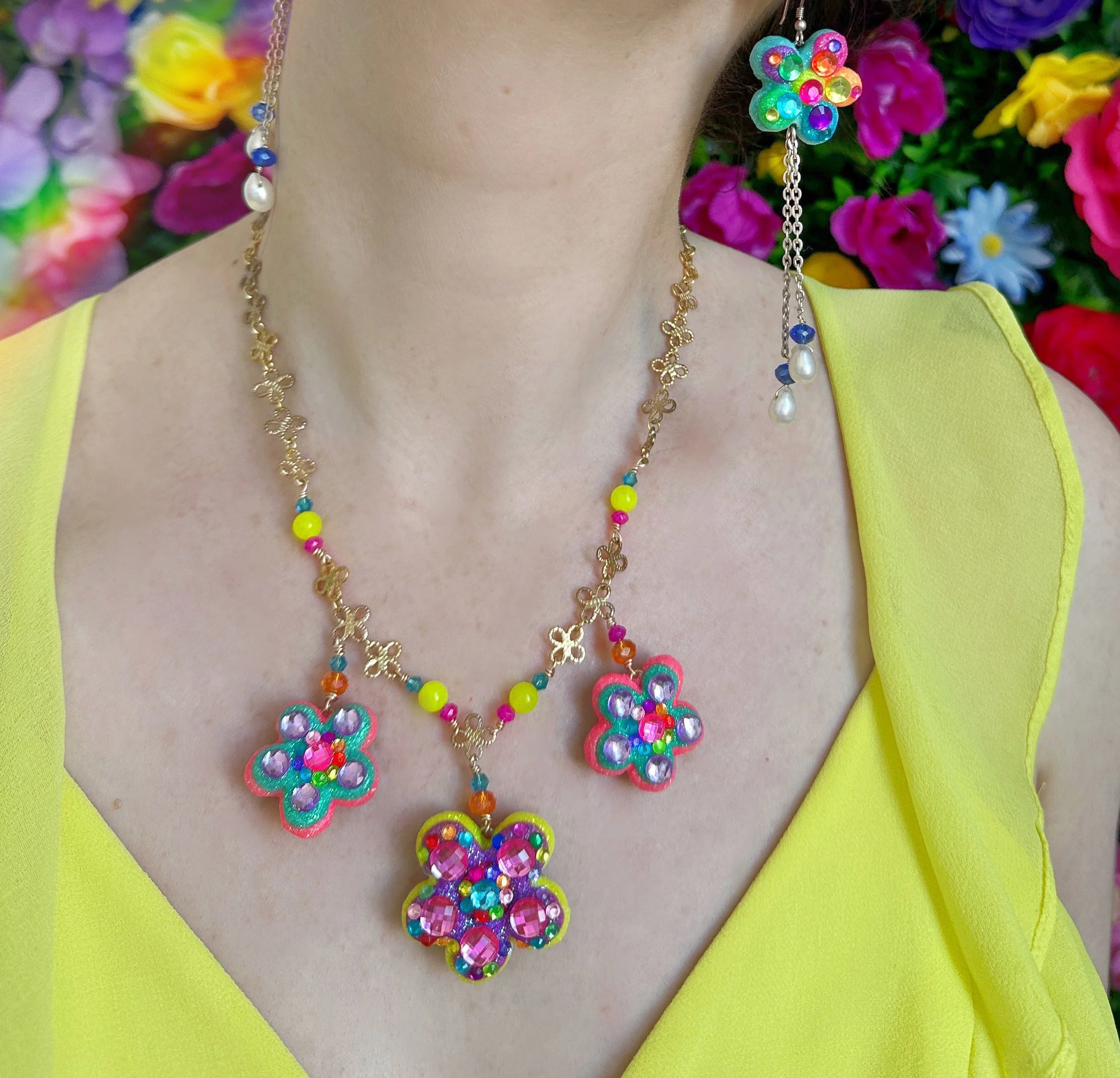 Isadora Flowers Necklace On Yellow.jpeg