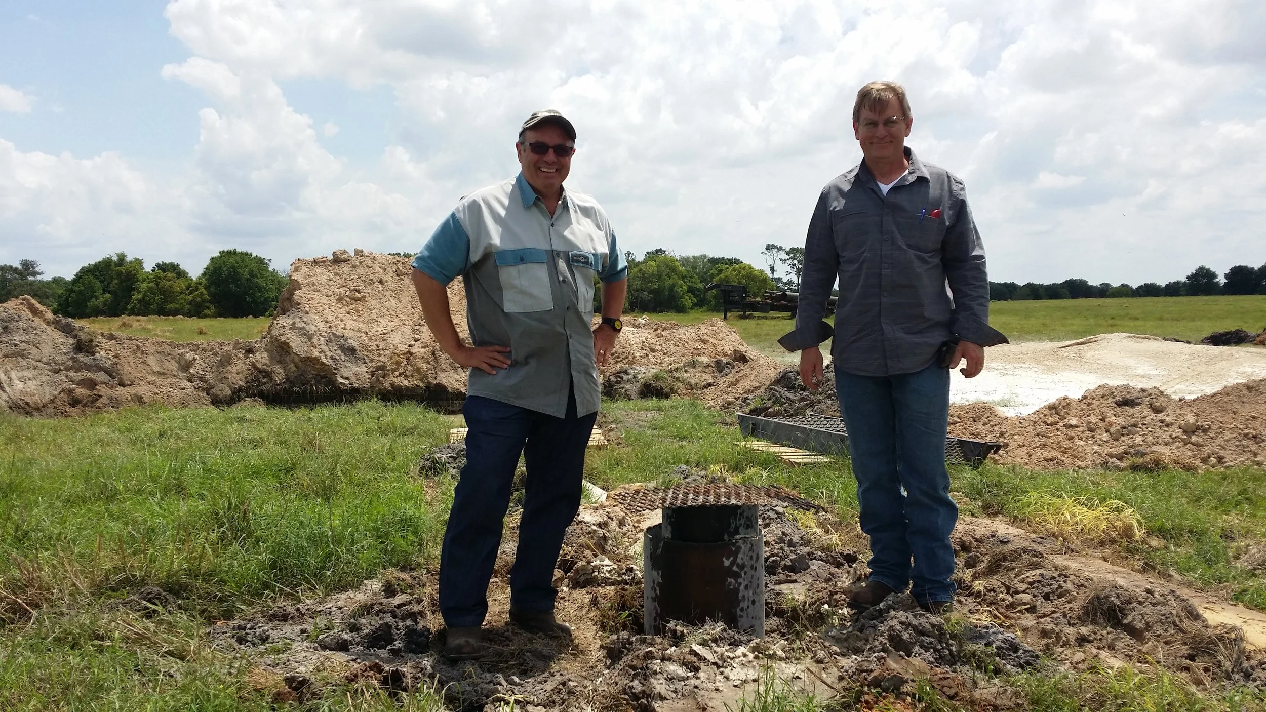 Jim with Birge Sigety at the new well head.