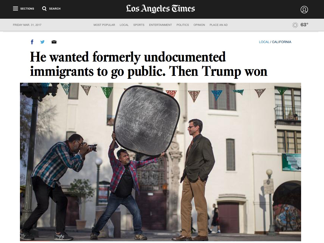 Project photographer Noe Montes, left, photographs Adan Ortega of Fullerton for Miguel Luna's, middle, Power of U project on Feb. 8, 2017, in Los Angeles. (Gina Ferazzi / Los Angeles Times)