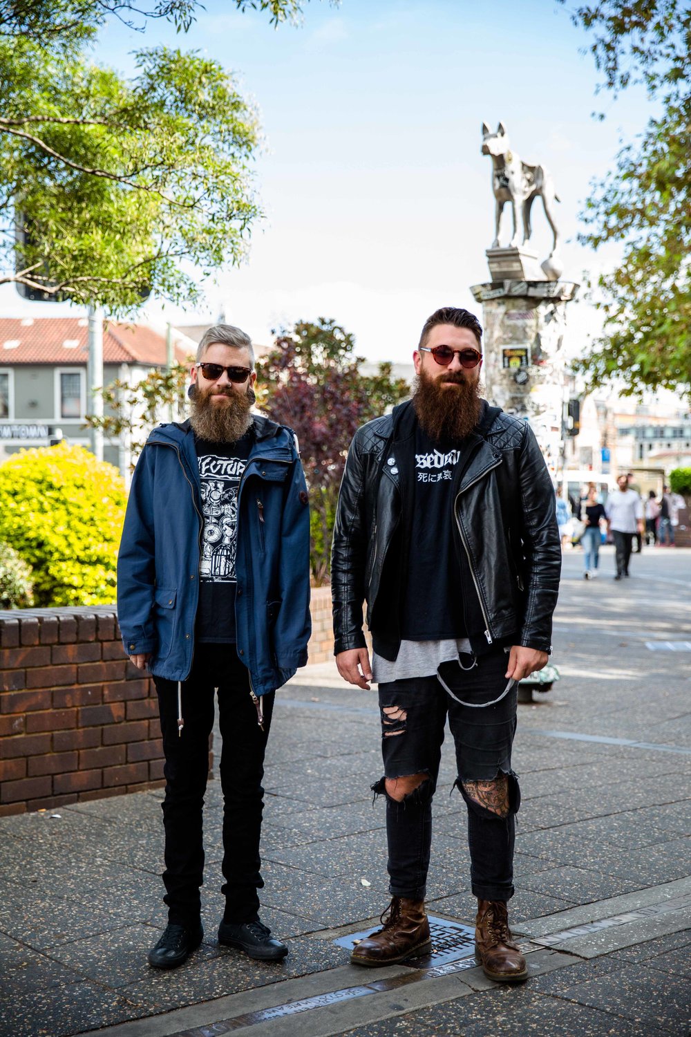  Some gentlemen on the streets of Newtown wearing vintage and second finds. The gentlemen on the right shared with us that he up-cycled hus jumper by cutting out the hoodie and  created natural looking wear and tear in his shirt for a more edgy, stre