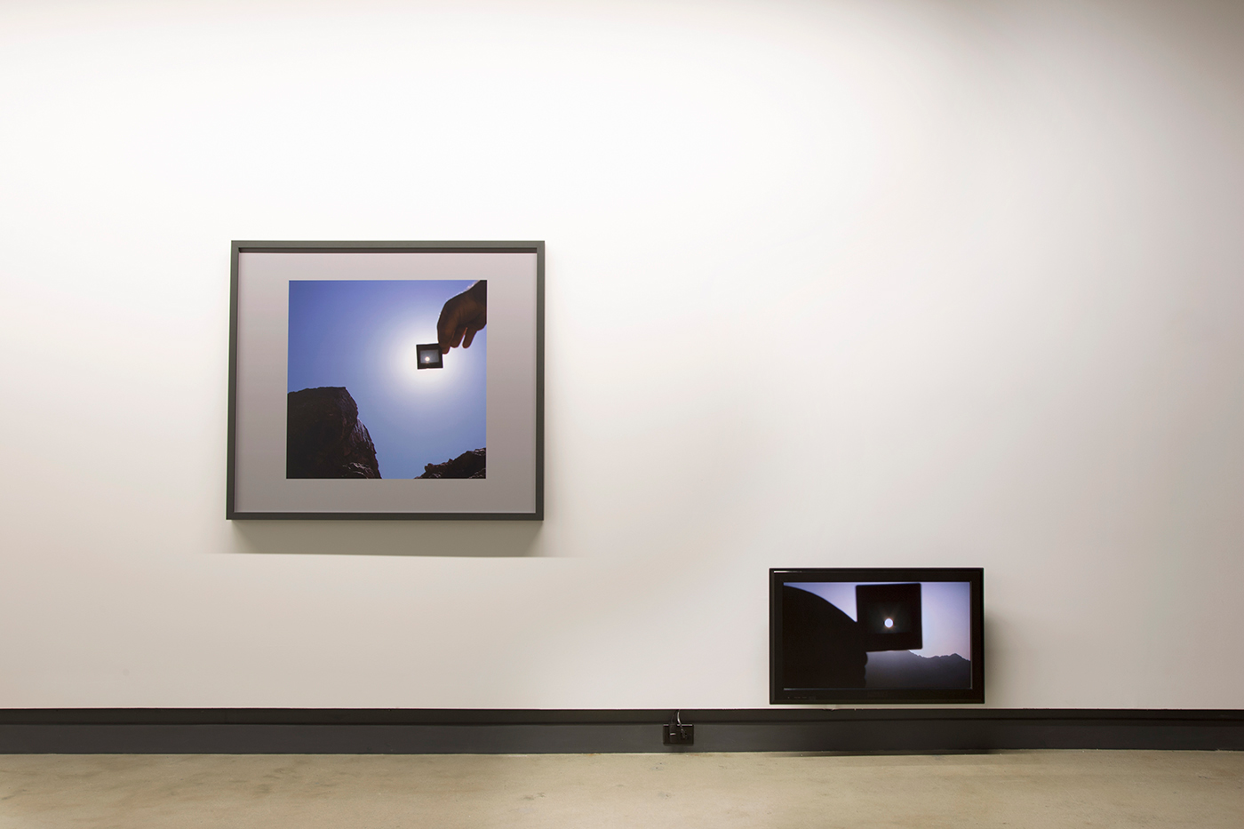 © Scott Massey, Transit (viewed through unexposed processed transparency film) and Transit Day (2013). Exhibition view. Photo: Sara A. Tremblay.