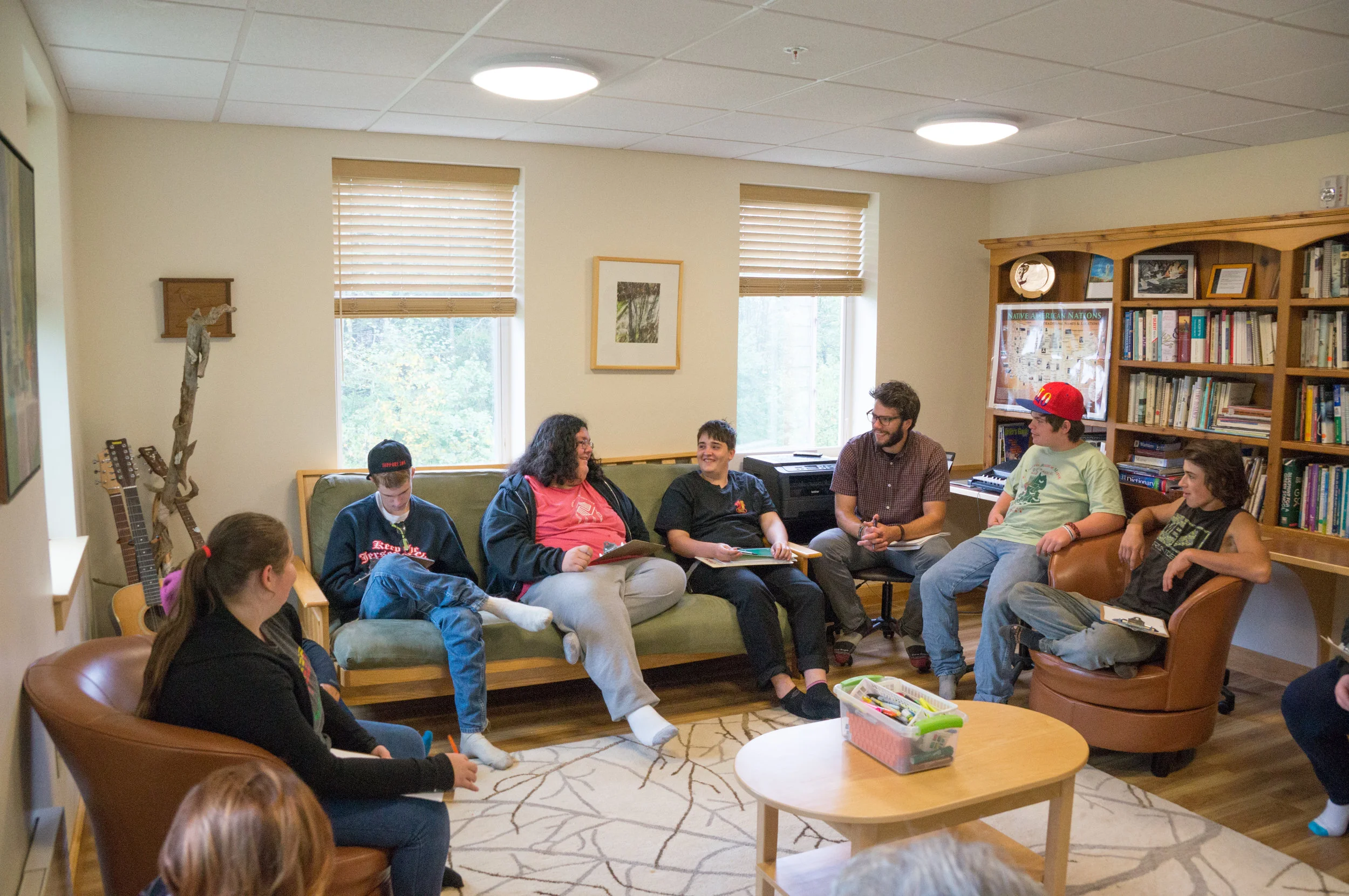 Students meeting with Marjorie Withers, former director of the Community Caring Collaborative