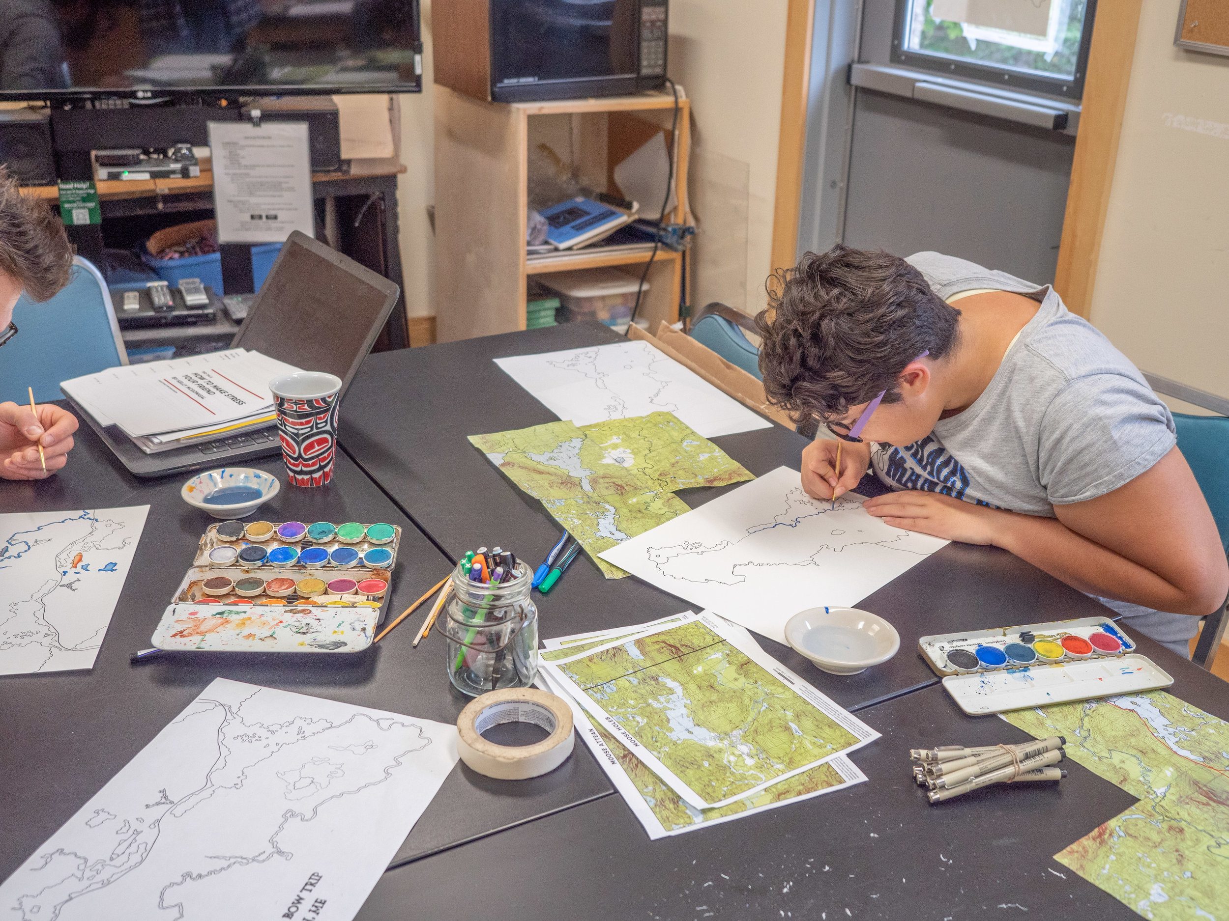 Cobscook students working on Story Maps about their recent canoe trip.