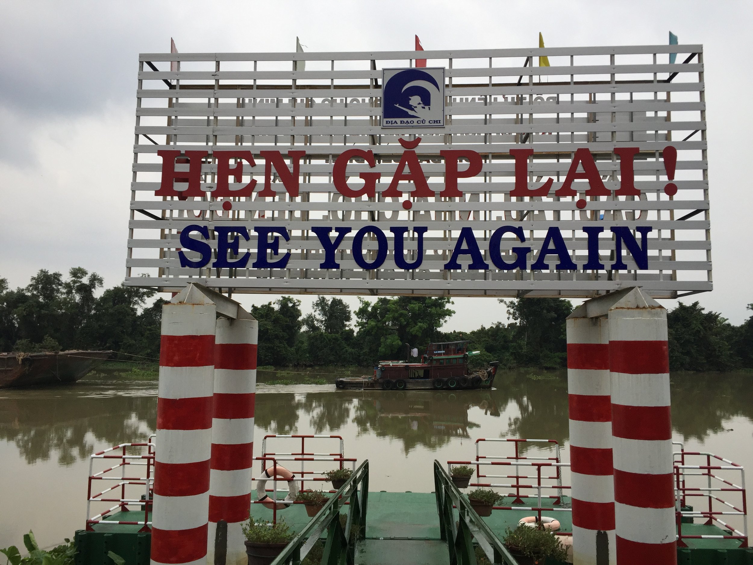 A lazy river barge makes its way down the Saigon River.