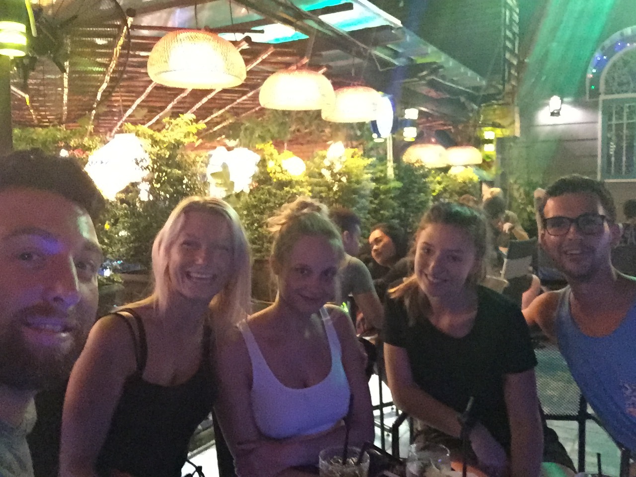 Refugees from Backpacker Street, grabbing a drink at a rooftop bar.