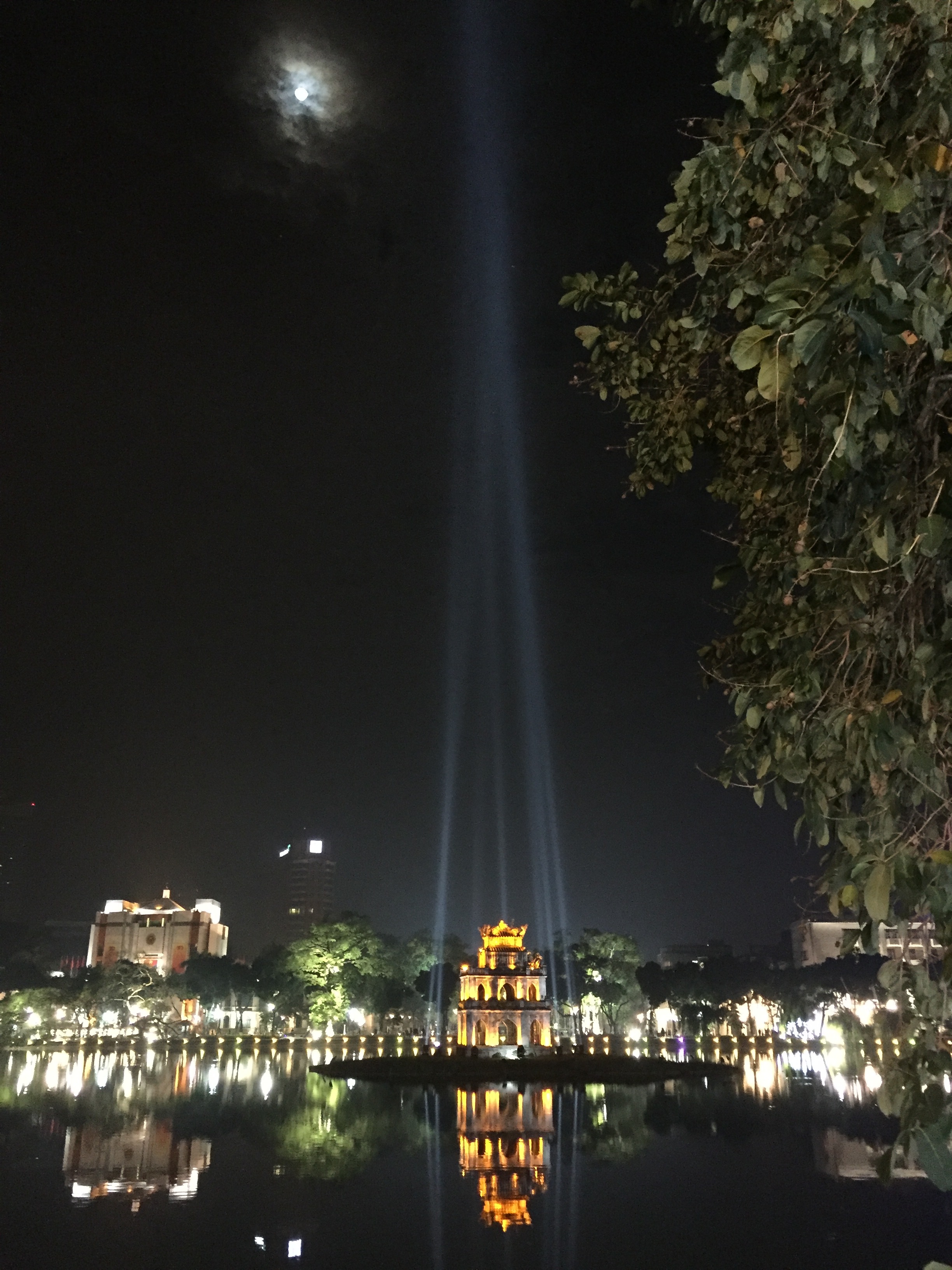 The Turtle Tower at night in Hanoi's Hoàn Kiếm Lake.