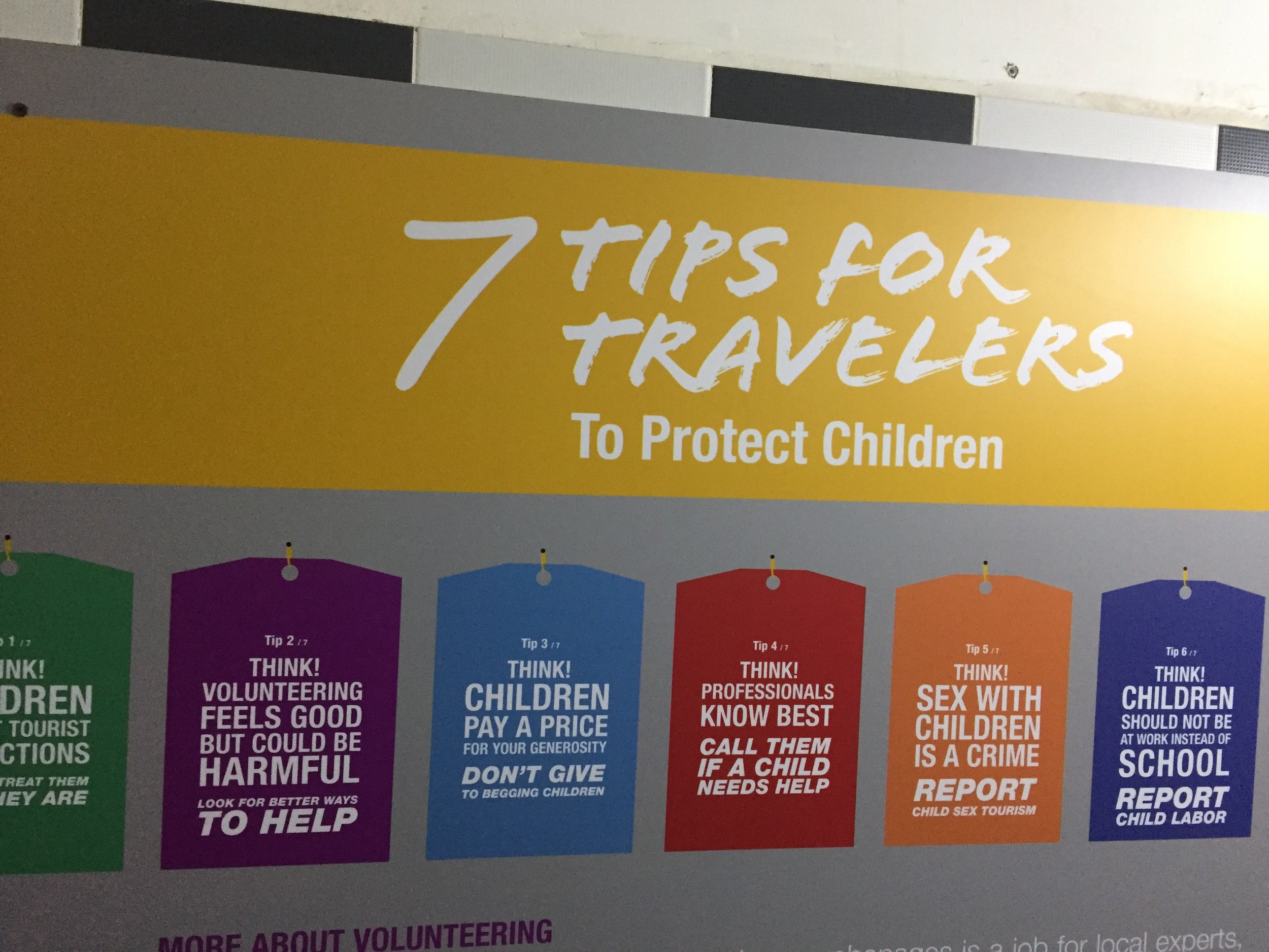 Signs advising tourists on responsible voluntourism at the Footprints Café .