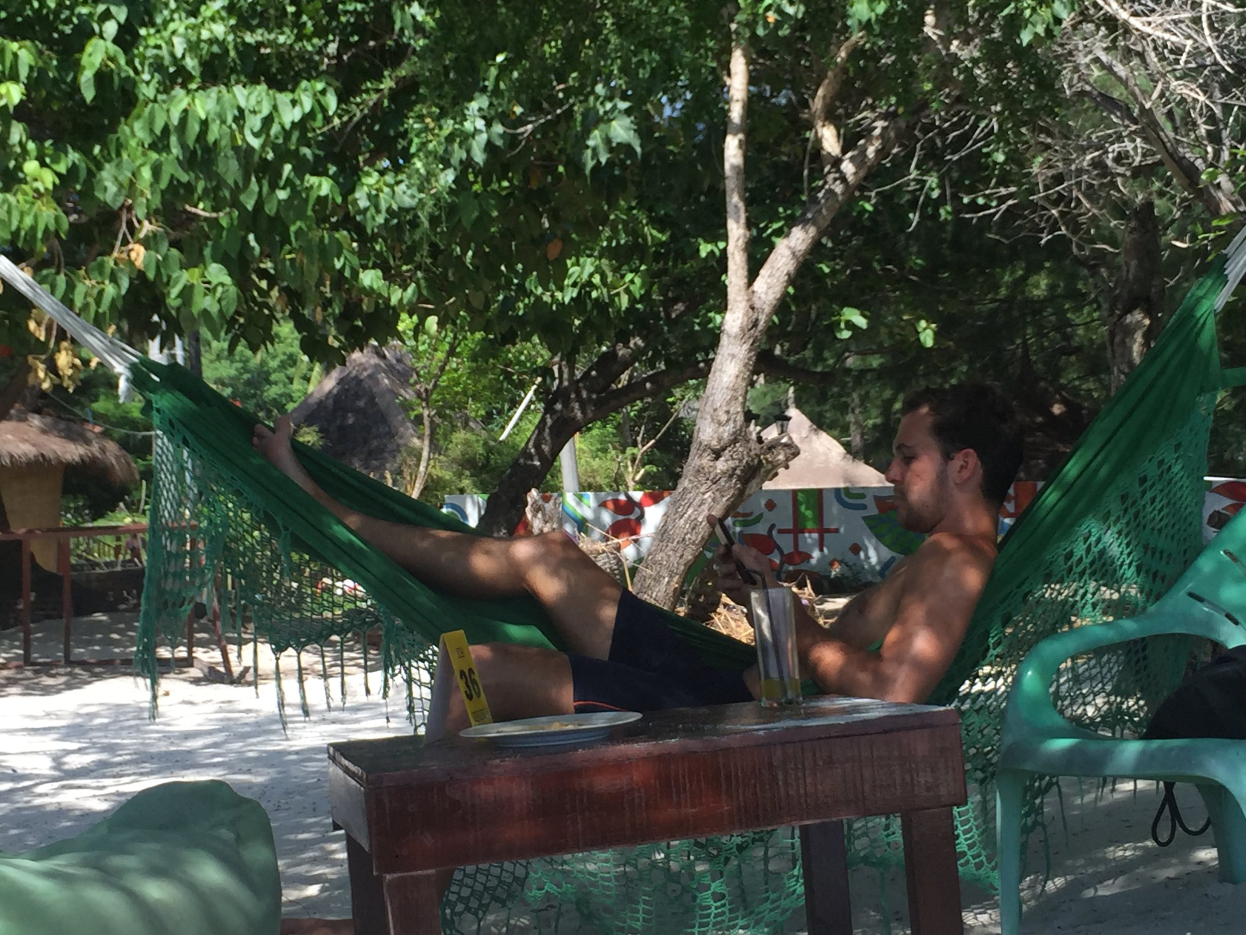 Papa Nik gets some beach reading done.