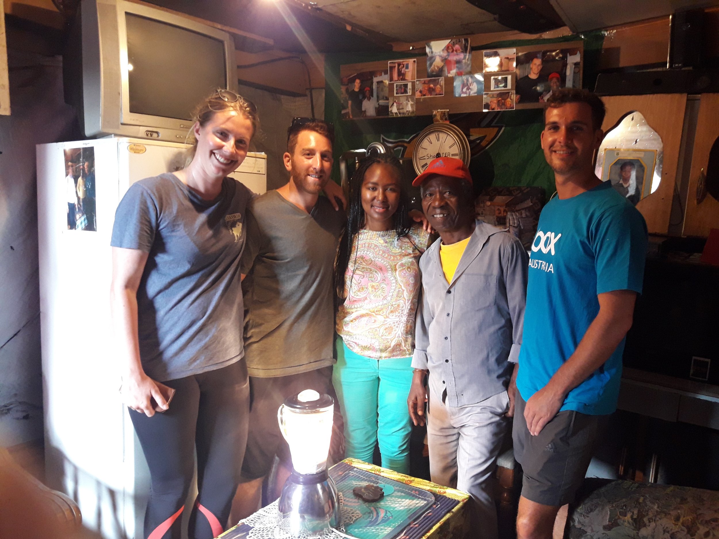 With our tour guide, Zuzeka, and Shooter, in his house.