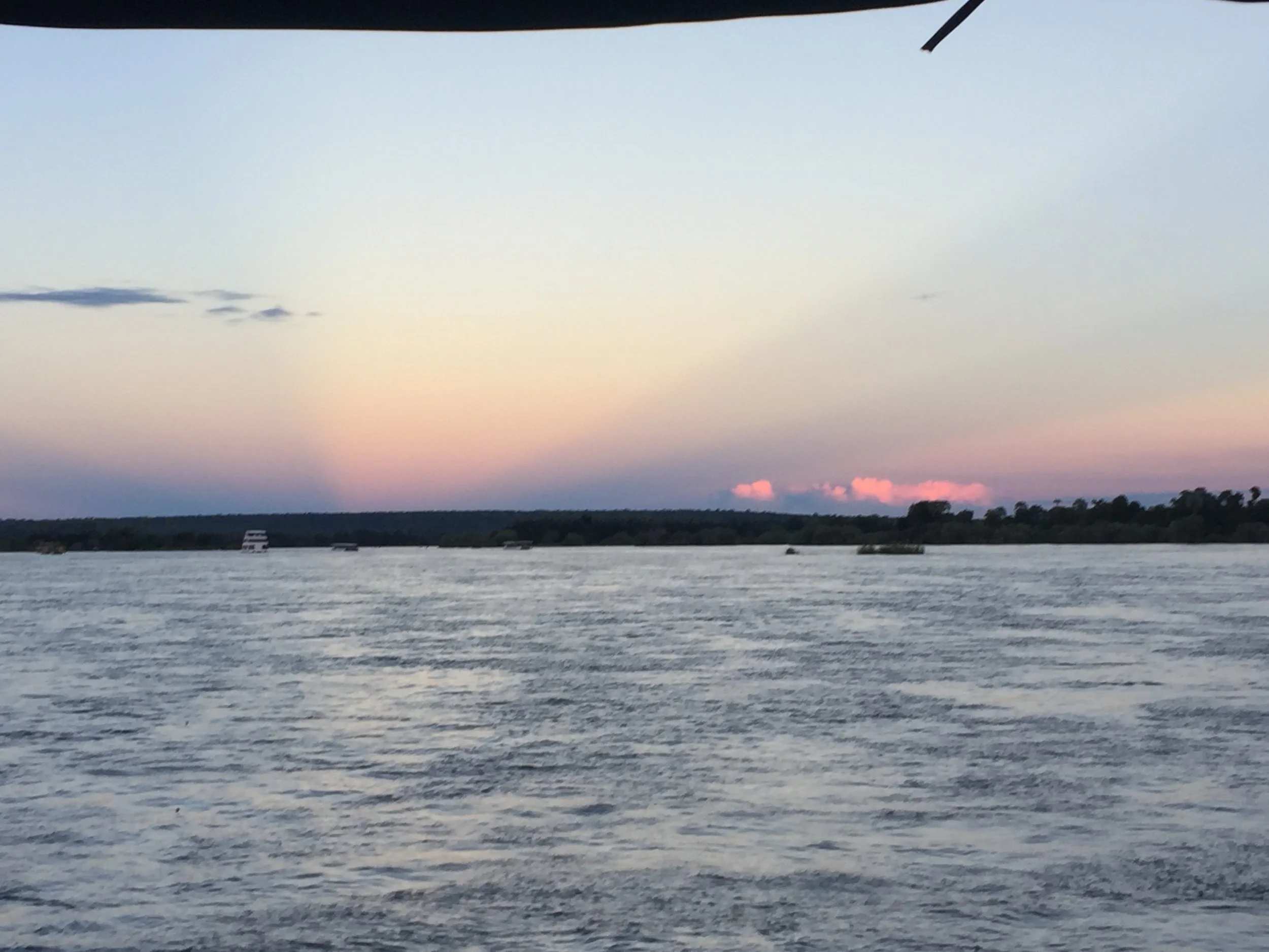 Sunset cruise views along the Zambezi River (which spills into Vic Falls.)