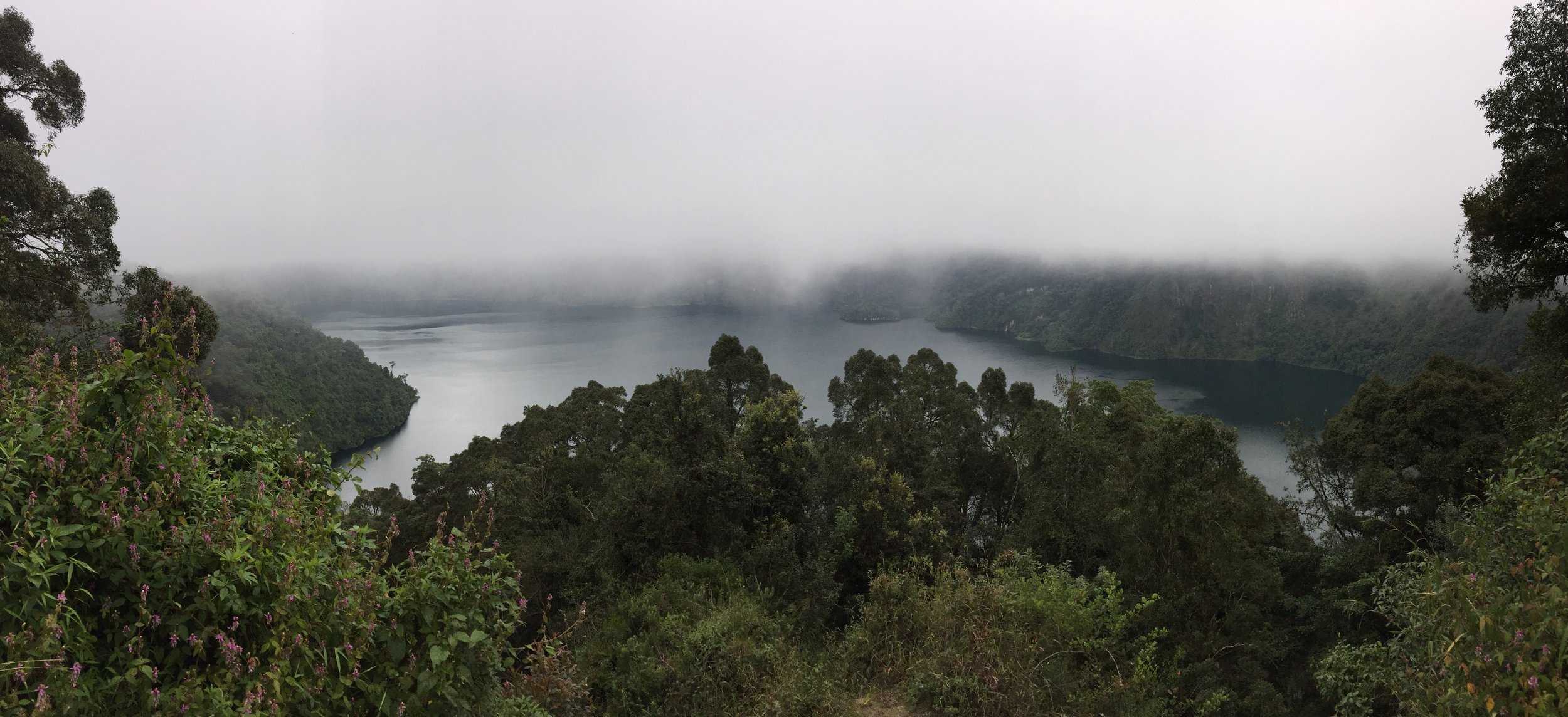 Our view down into the Ngozi Crater lake from the cliffside. As we sat looking into the silent lake, fog slowly descended into the crater, obscuring our view.