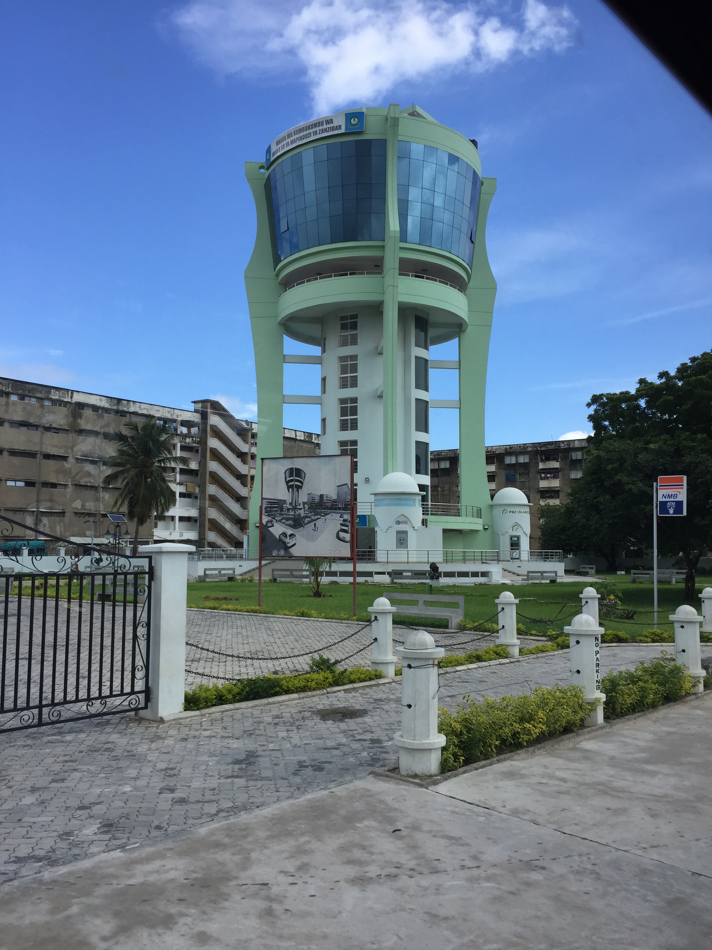 The poster in front of this residential area in Zanzibar town shows the discrepancy between how it was supposed to look and how it looks.