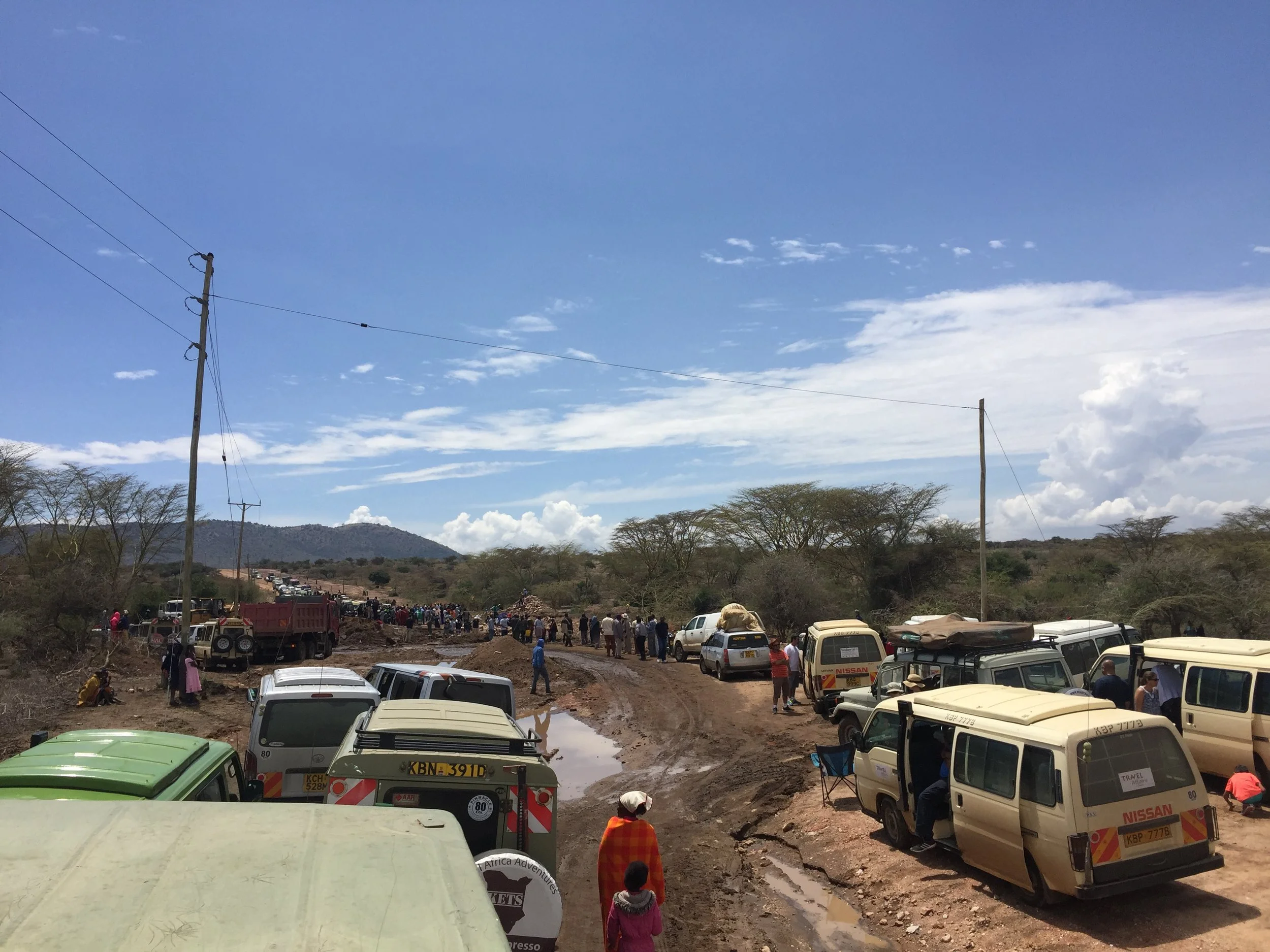 On our way into the Maasai Mara, the only road in washed out the night prior.