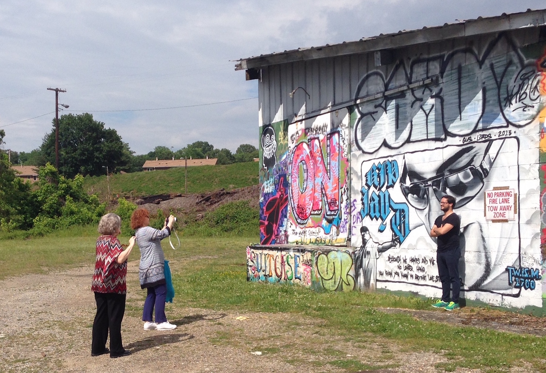 Journalists from France were fascinated by the murals in the River Arts District!
