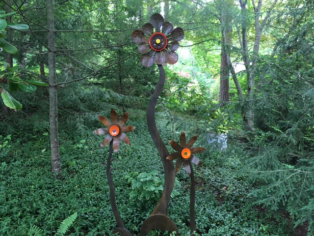 Perky and Quirky Flowers are forged, foraged and fabricated steel, enamel and patina.