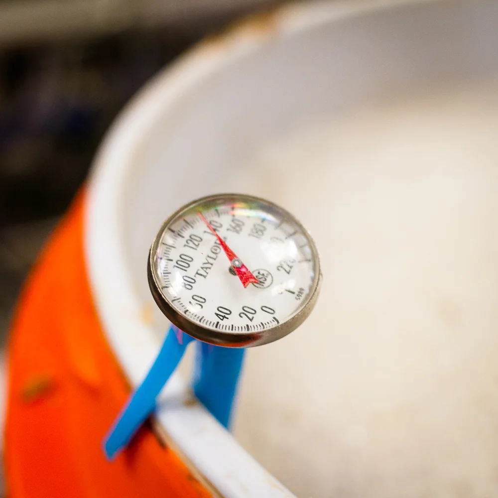 Bucket with beer and temperature gauge.