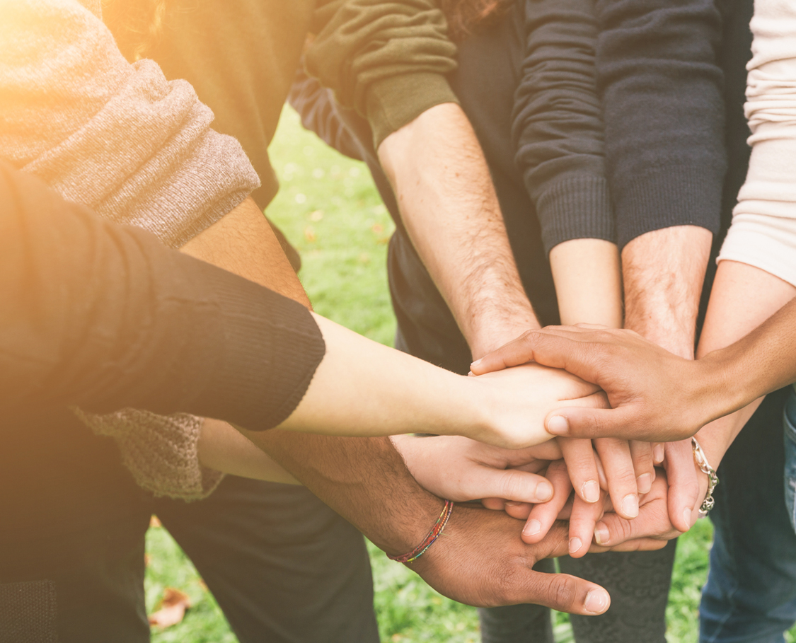 Multiracial Group of Friends with Hands in Stack, Teamwork