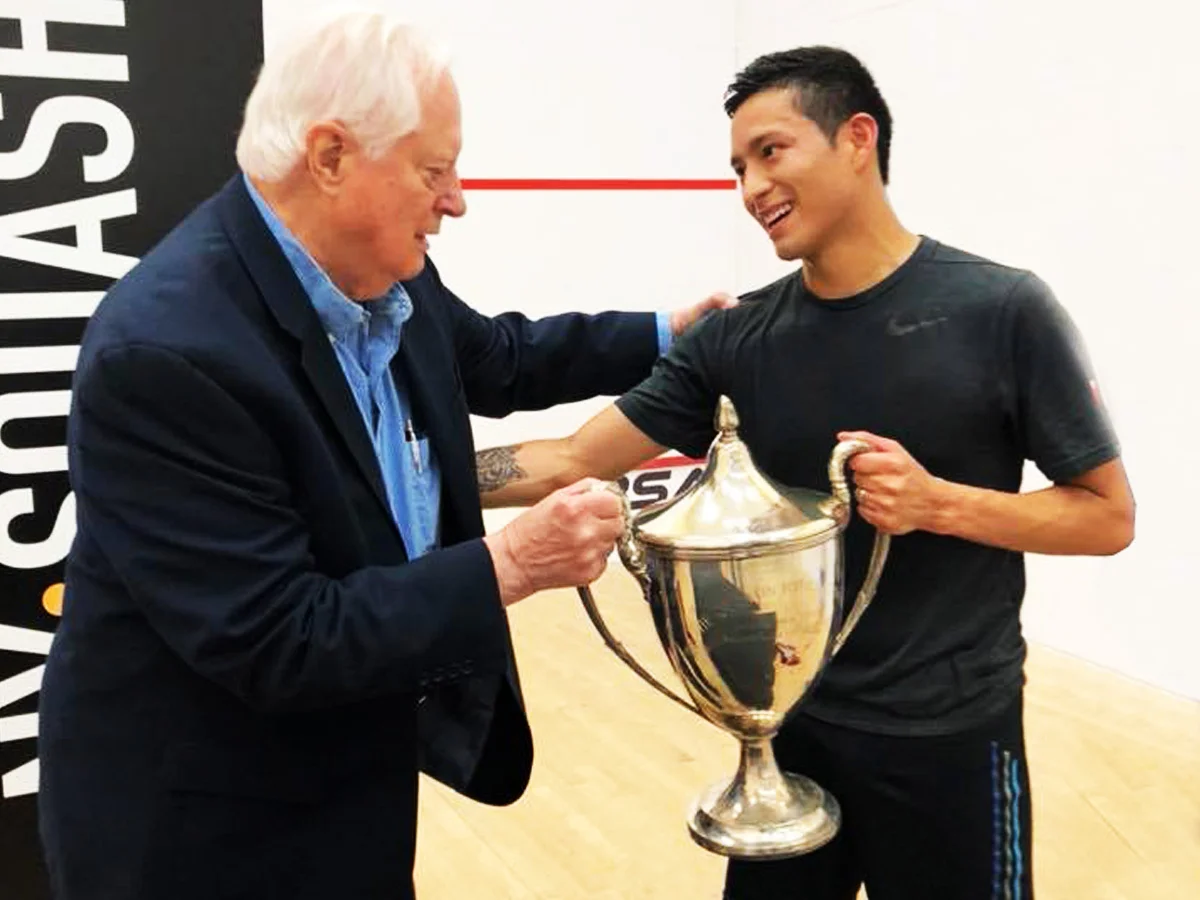 2018 Hyder PSA Pro Draw: Dr. Quentin Hyder, founder of the tournament, presents the Trophy to 2018 champion Alfredo Avila.