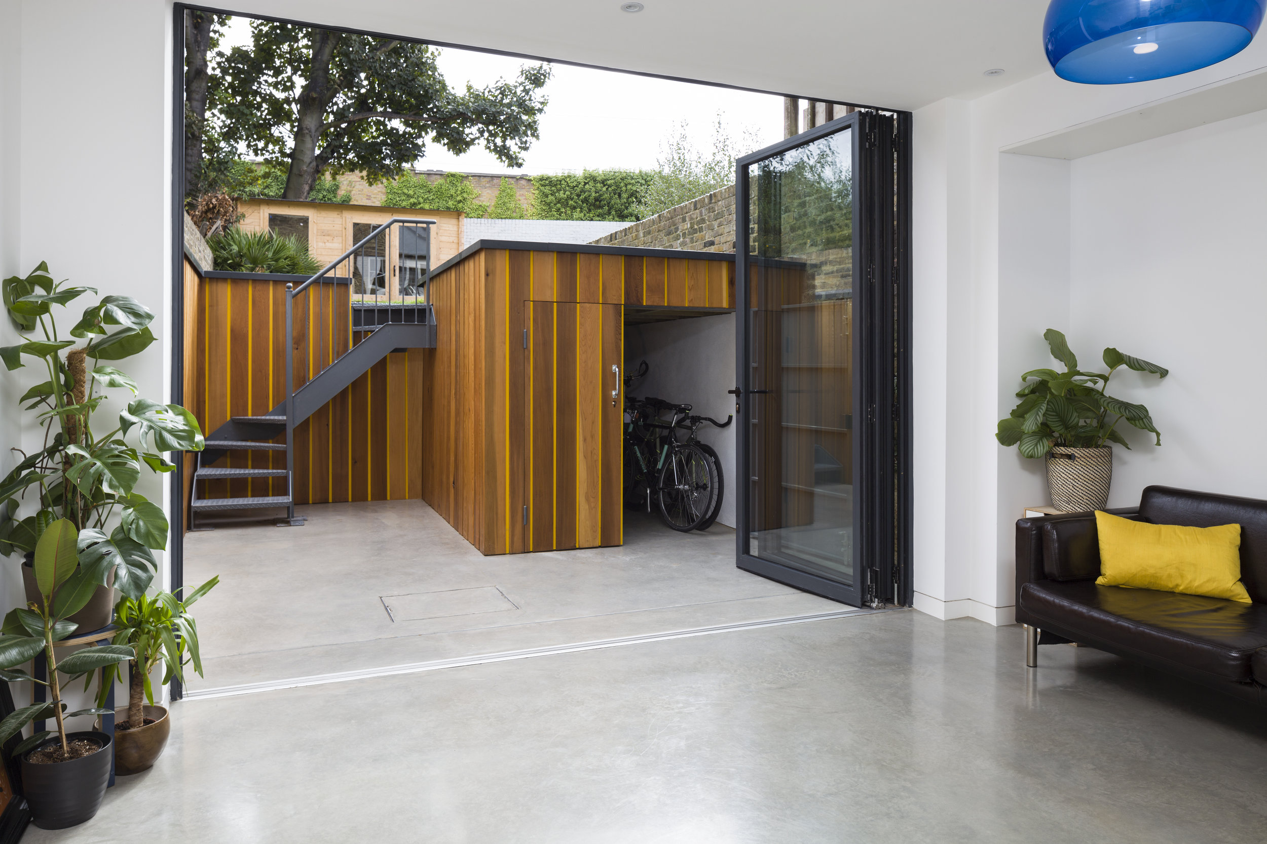 Full width bi-fold doors connect the garden to the interior.