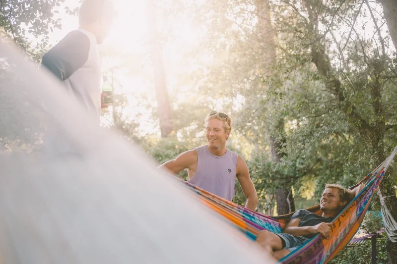 Guys laughing in hammock