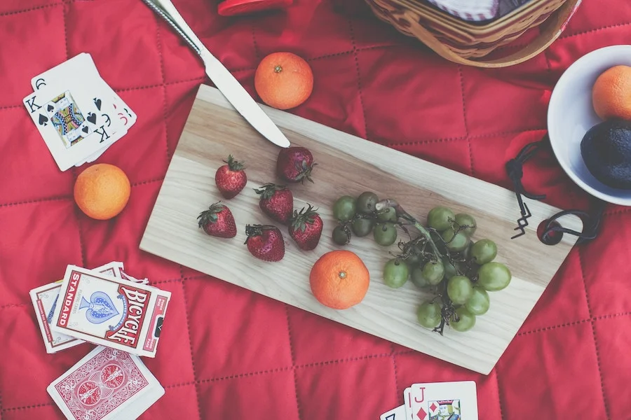 deck of cards on a table with food.jpg