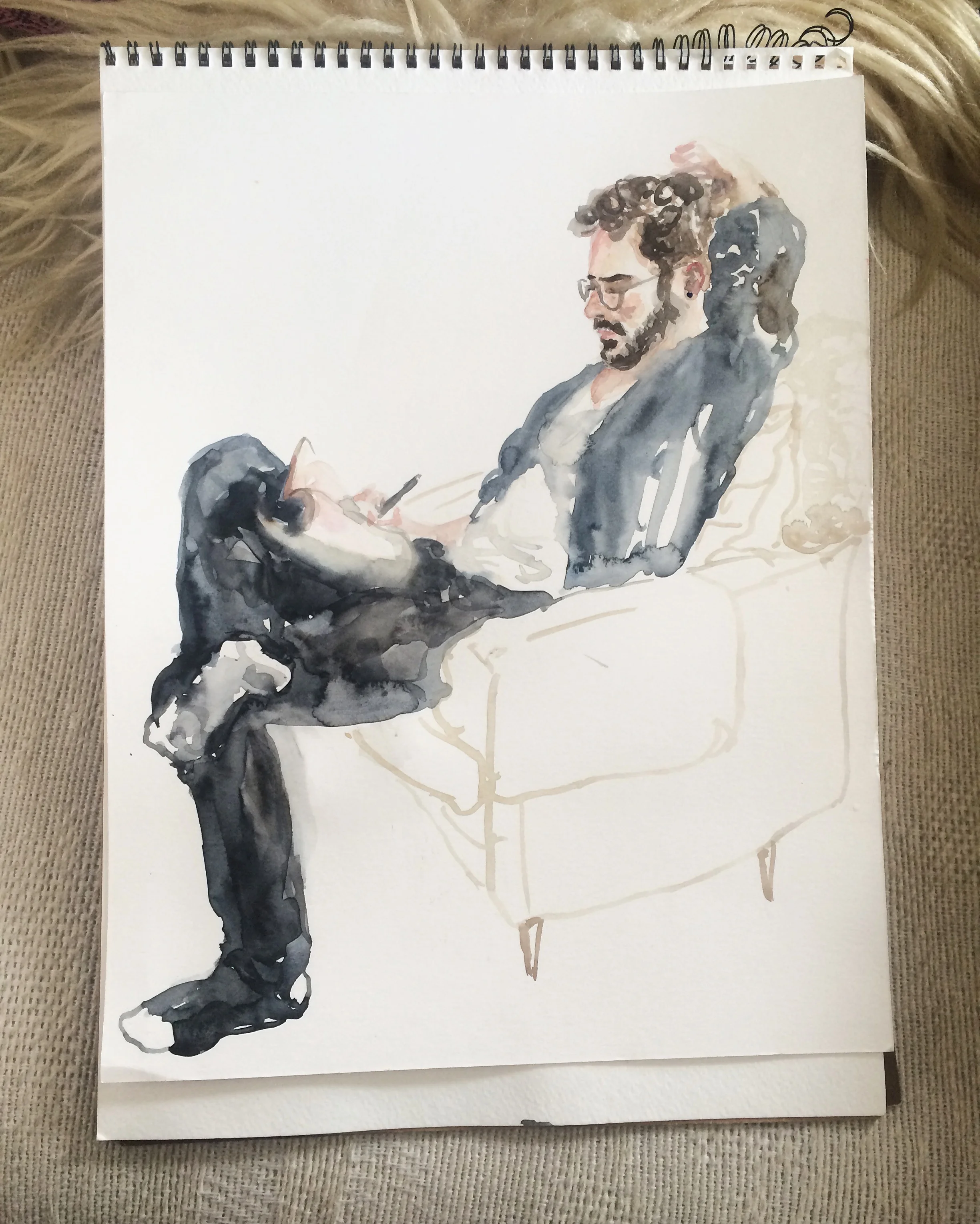 Joel, twirling his hair and grant writing.