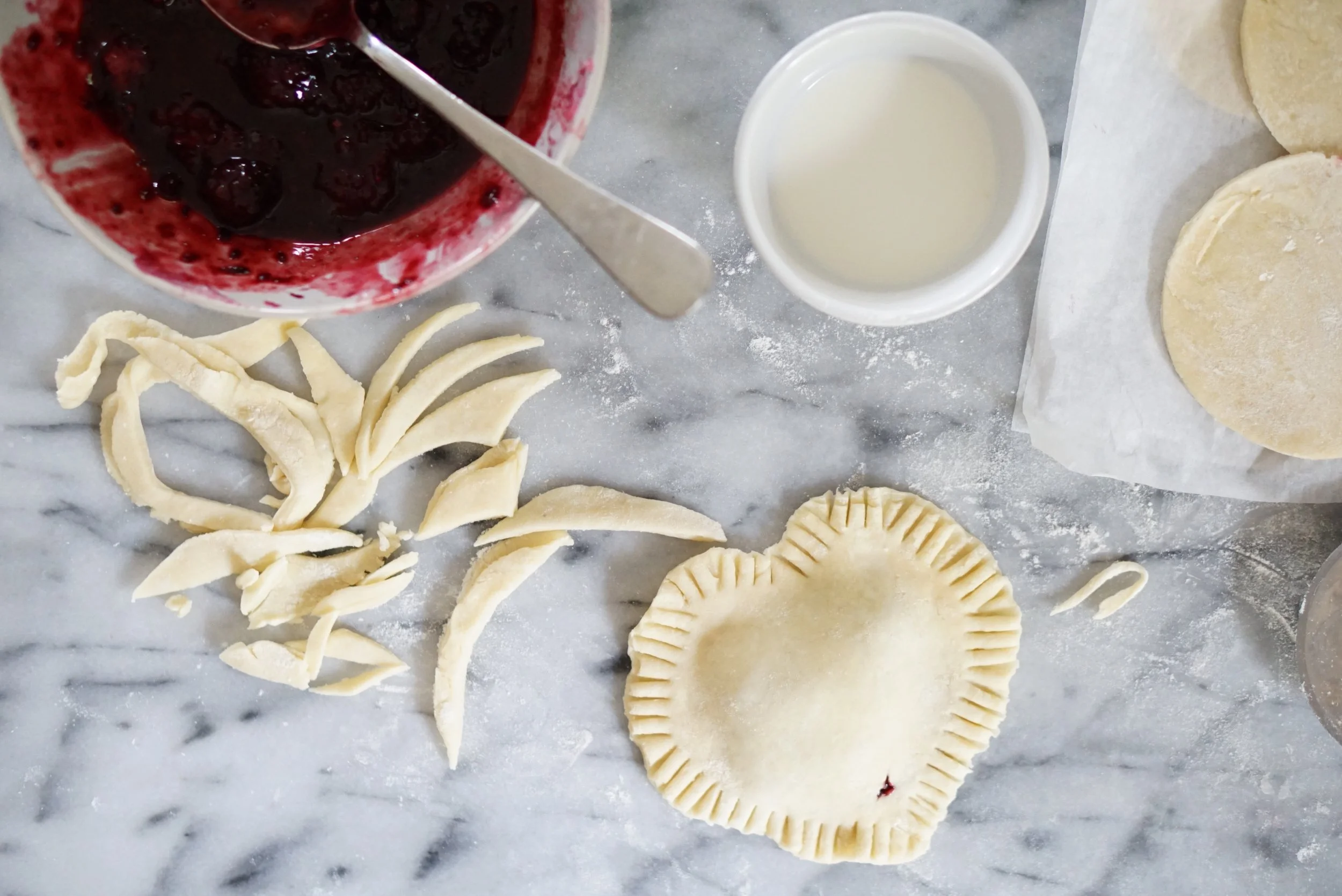Cut into the shape of a heart then crimp the edges with a fork. 