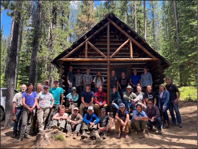 YCC Crew, Heritage Staff and volunteers in front of Trapper Cabin (2022).