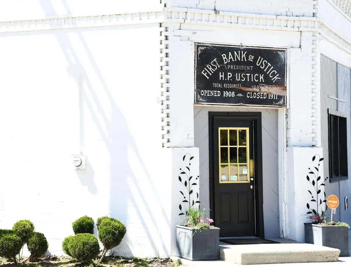 image of historic whitewashed brick building, originally the First Bank of Ustick in Boise, Idaho