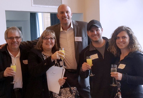 Don and Charlene Singbeil, Jeff Singbeil and Olivia Hill celebrating the purchasing of their lots at The Foothills with Marketing and Sales Director, Ben Hurlbutt.