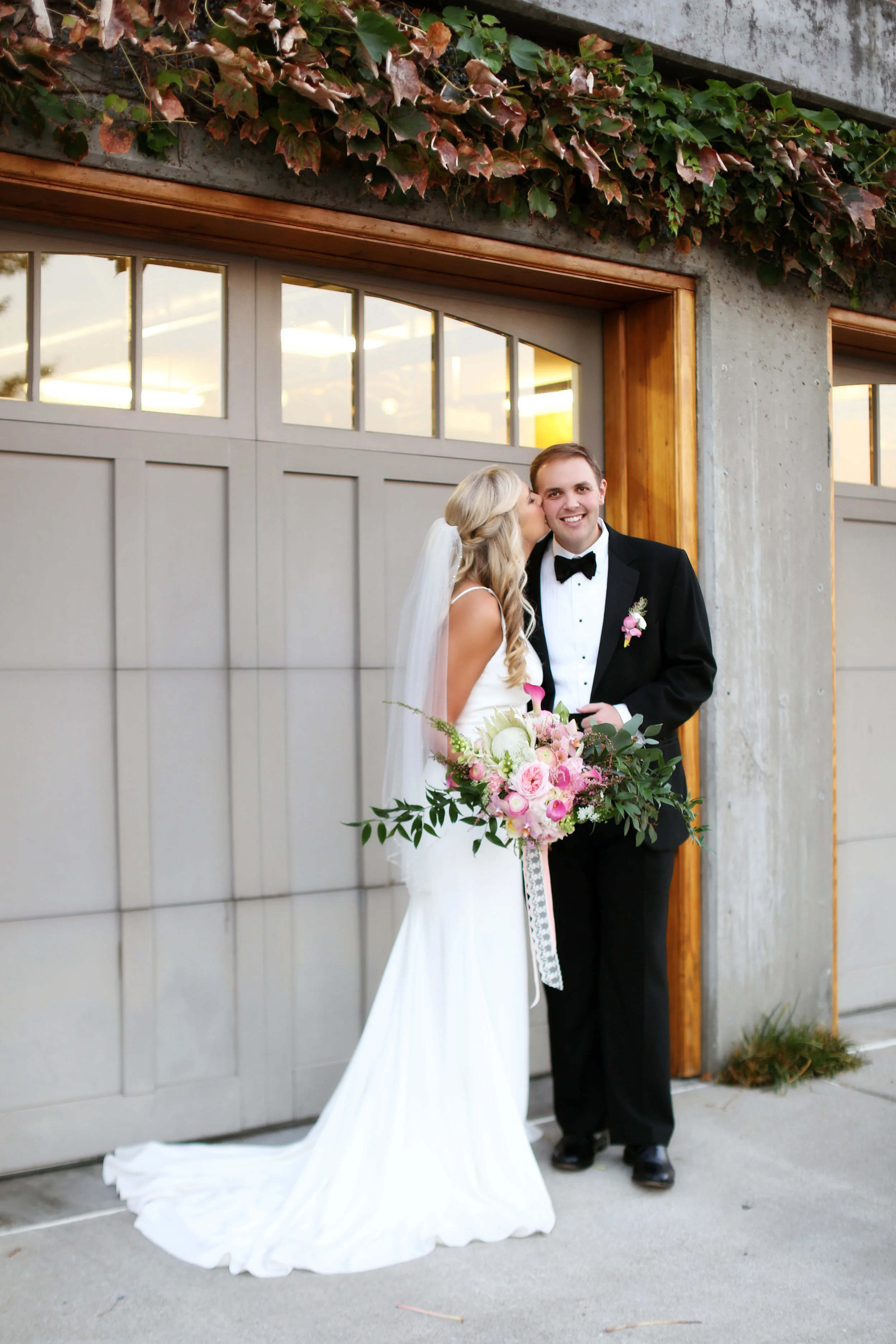 Hillary's bridal bouquet was a wild, assymetrical, free-form arrangement. Photo courtesy of Vita Dolce Images.
