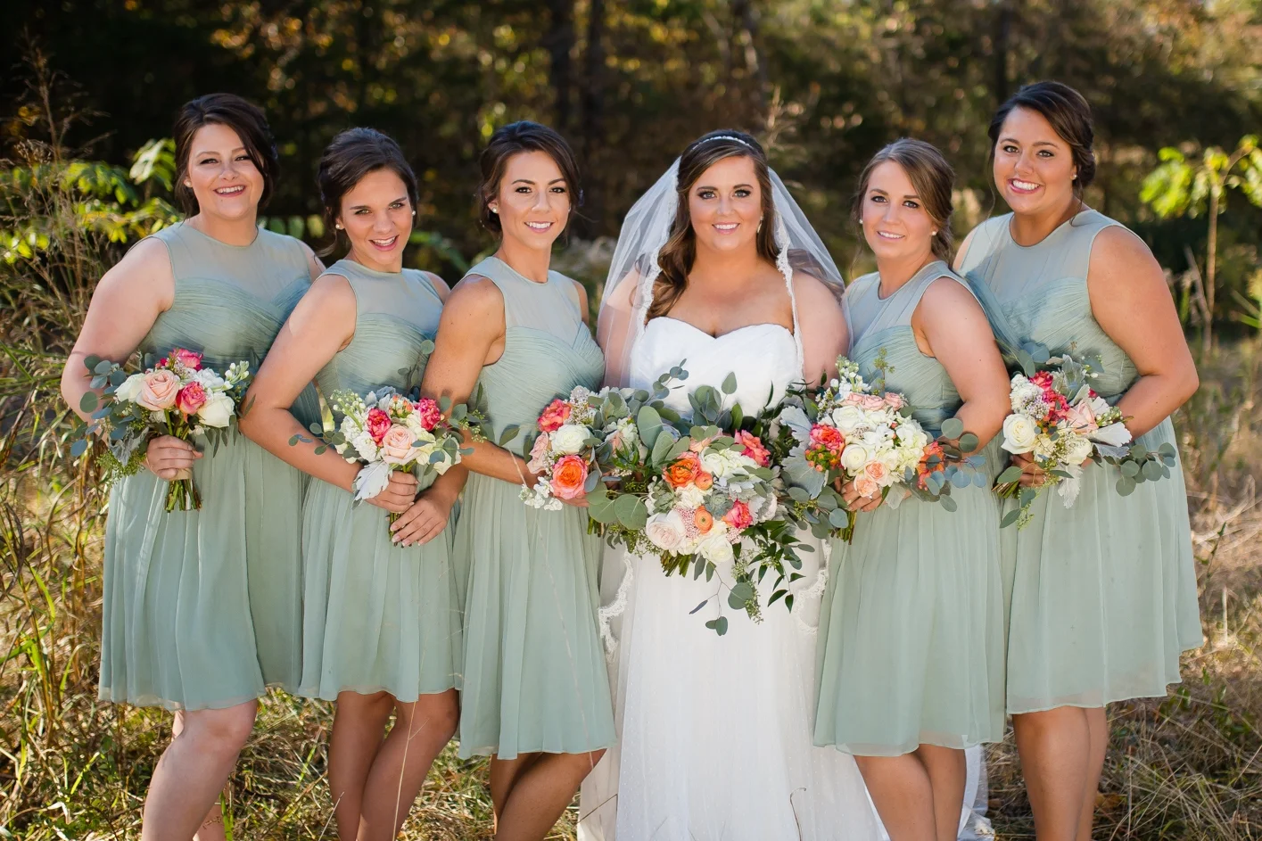 Courtney's long, flowing veil was mirrored in the trailing greenery coming off each bouquet.