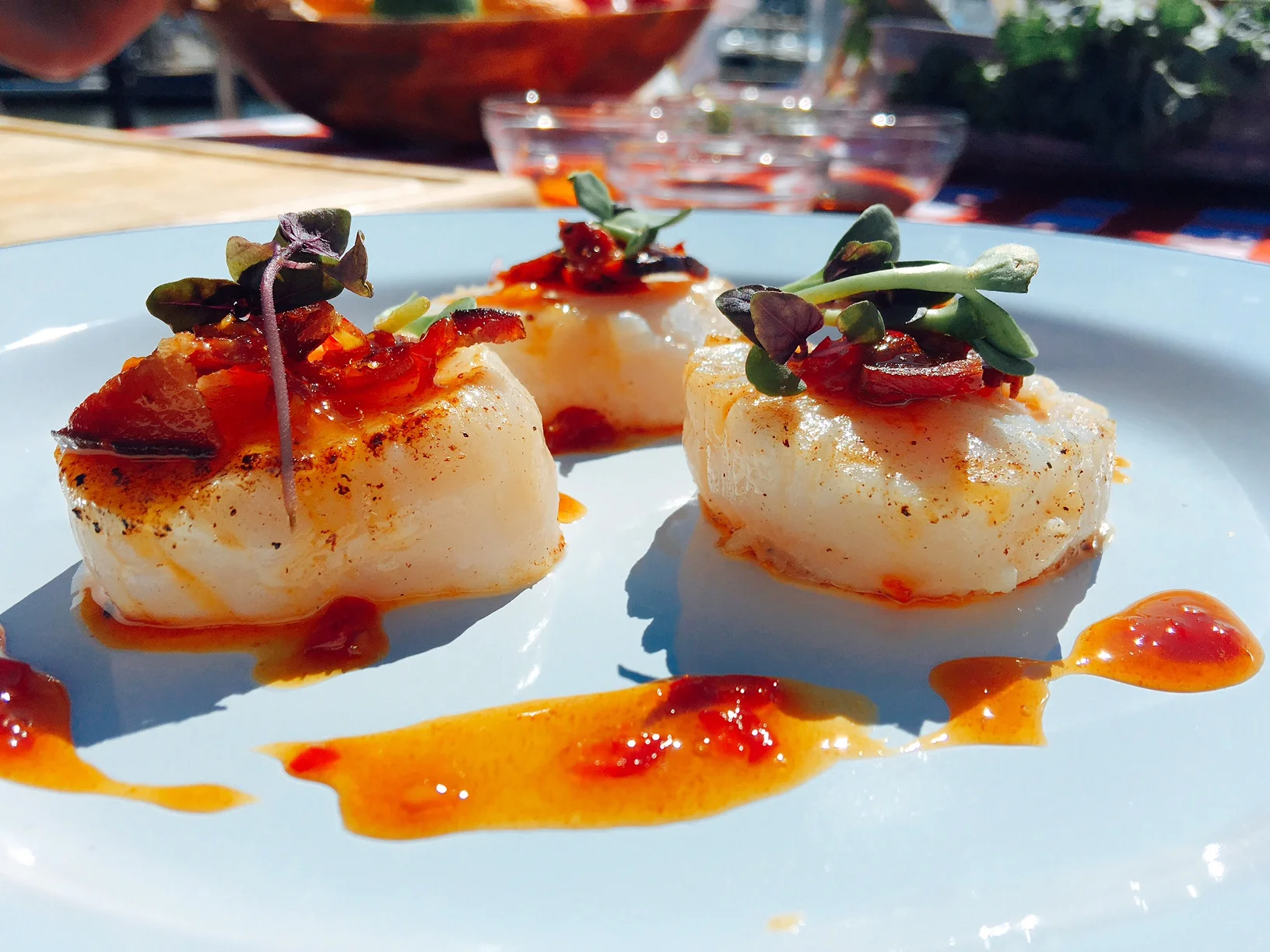 Pan seared scallops with crispy bacon and a chili maple ponzu sauce