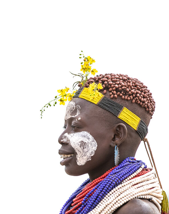 African tribe portrait showing Omo Valley womans face decorations and necklaces