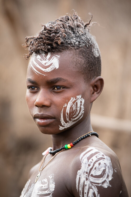 Omo Valley tribal boy body decorations from Karo tribe