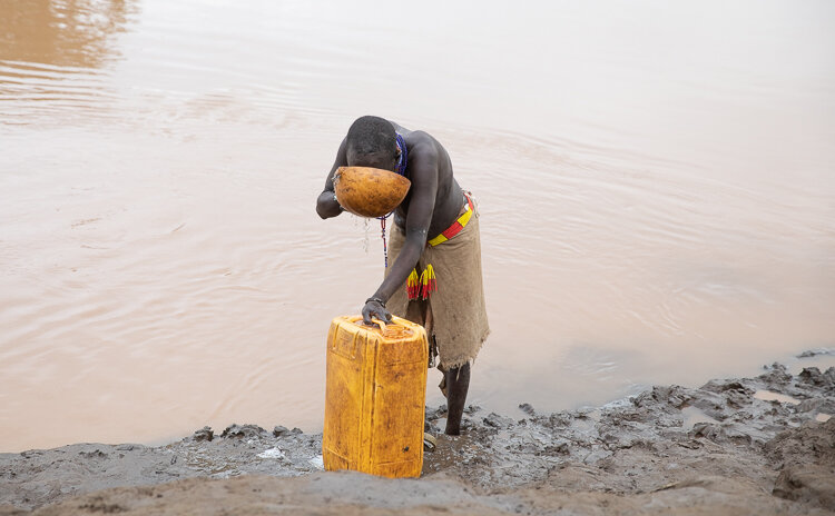 Karo Tribe village women Omo Valley collecting water