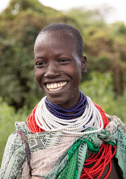 Ethiopia Omo Valley Kara tribe woman close up smiling