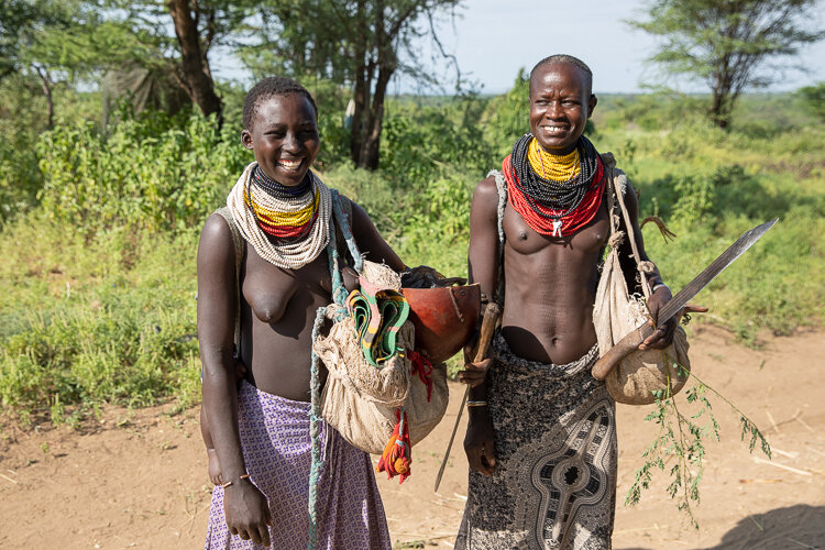 karo tribe women ready for work on the farms Omo Valley ethiopia
