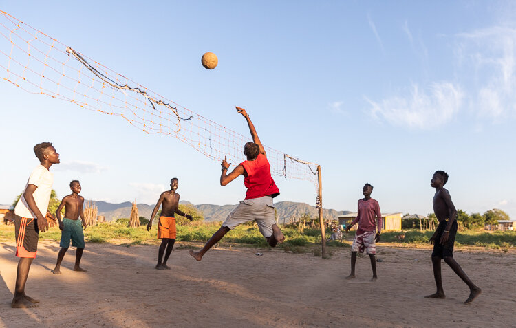 Joining in on their volleyball game