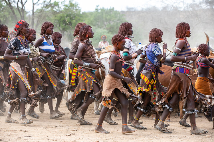 The women wear tishirts but most have bare backs