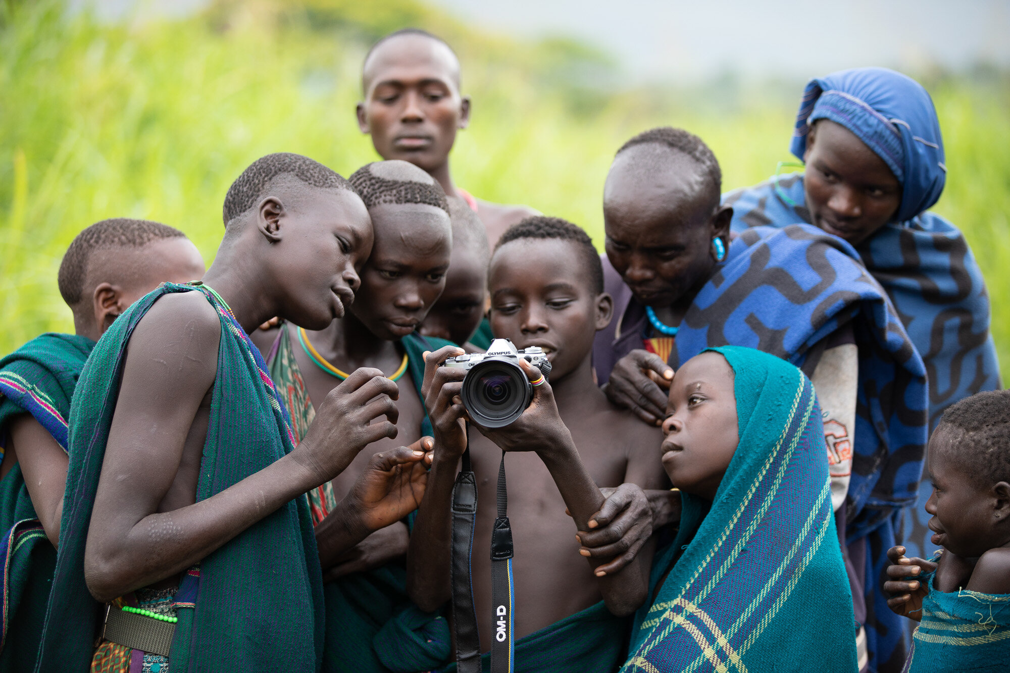 The chief and children enjoying using my Olympus