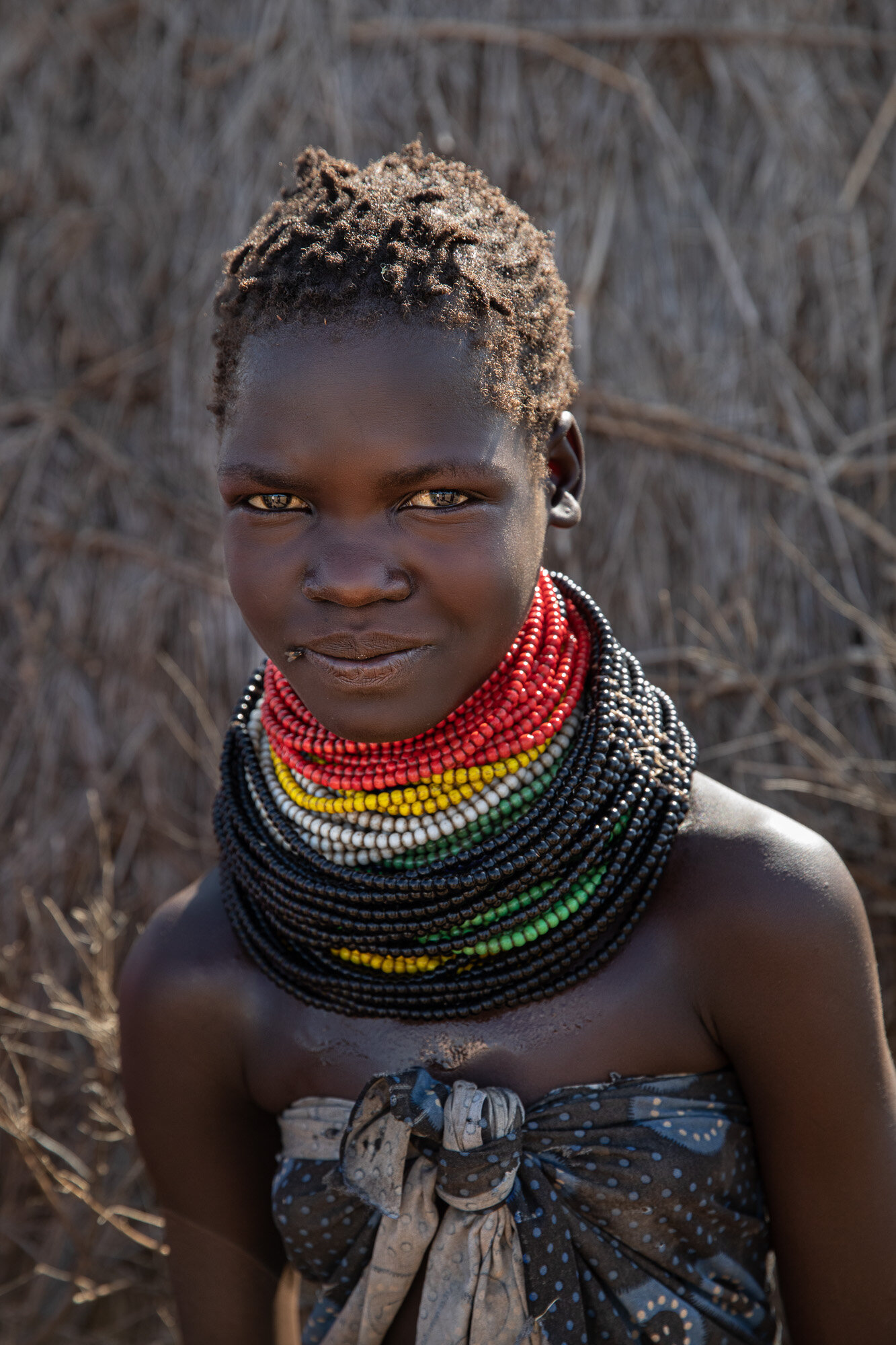 Nyangatom tribe girl with necklaces ethiopia 