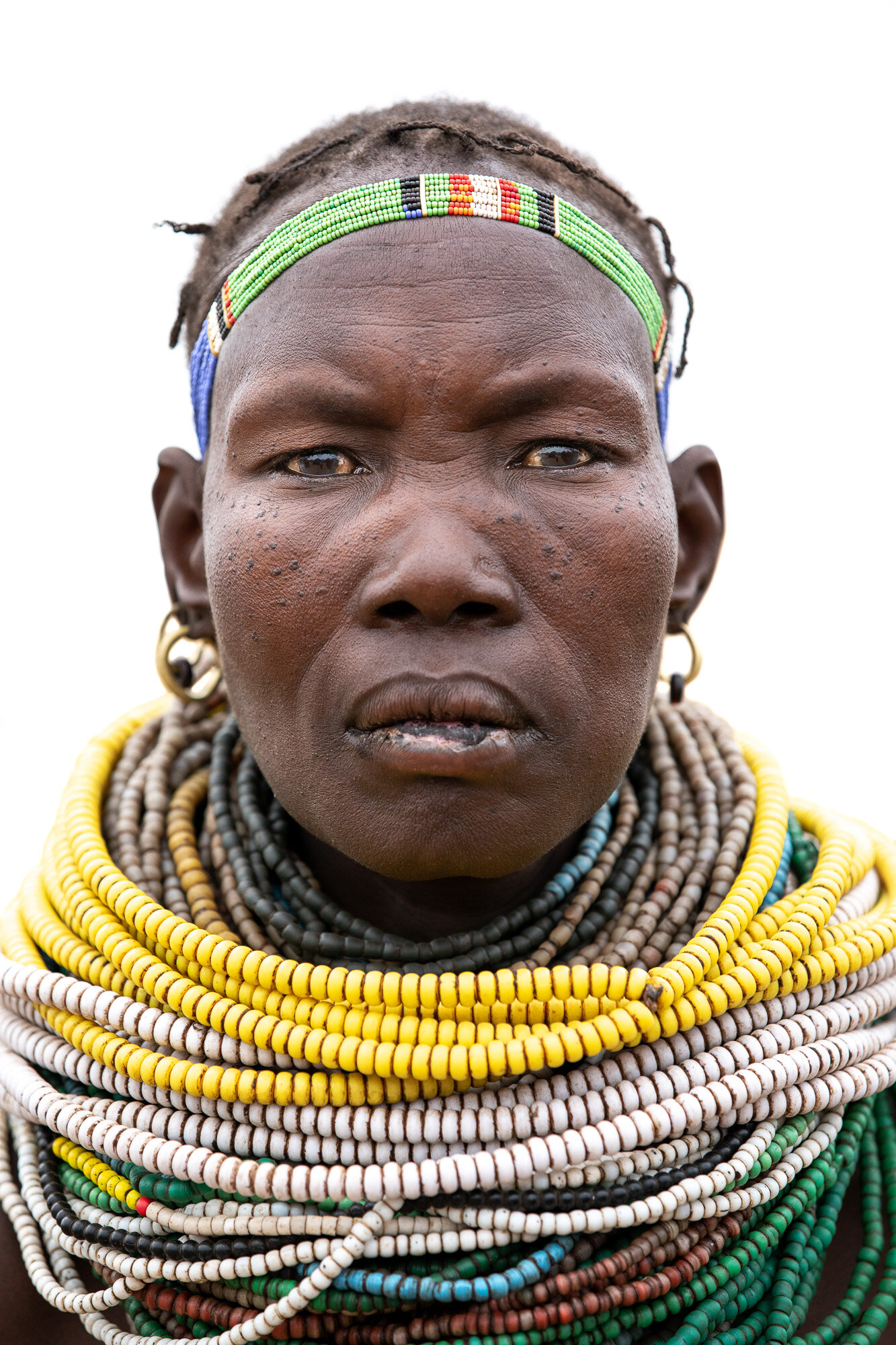 Nyangatom tribal woman portrait on Omo Valley photo tour