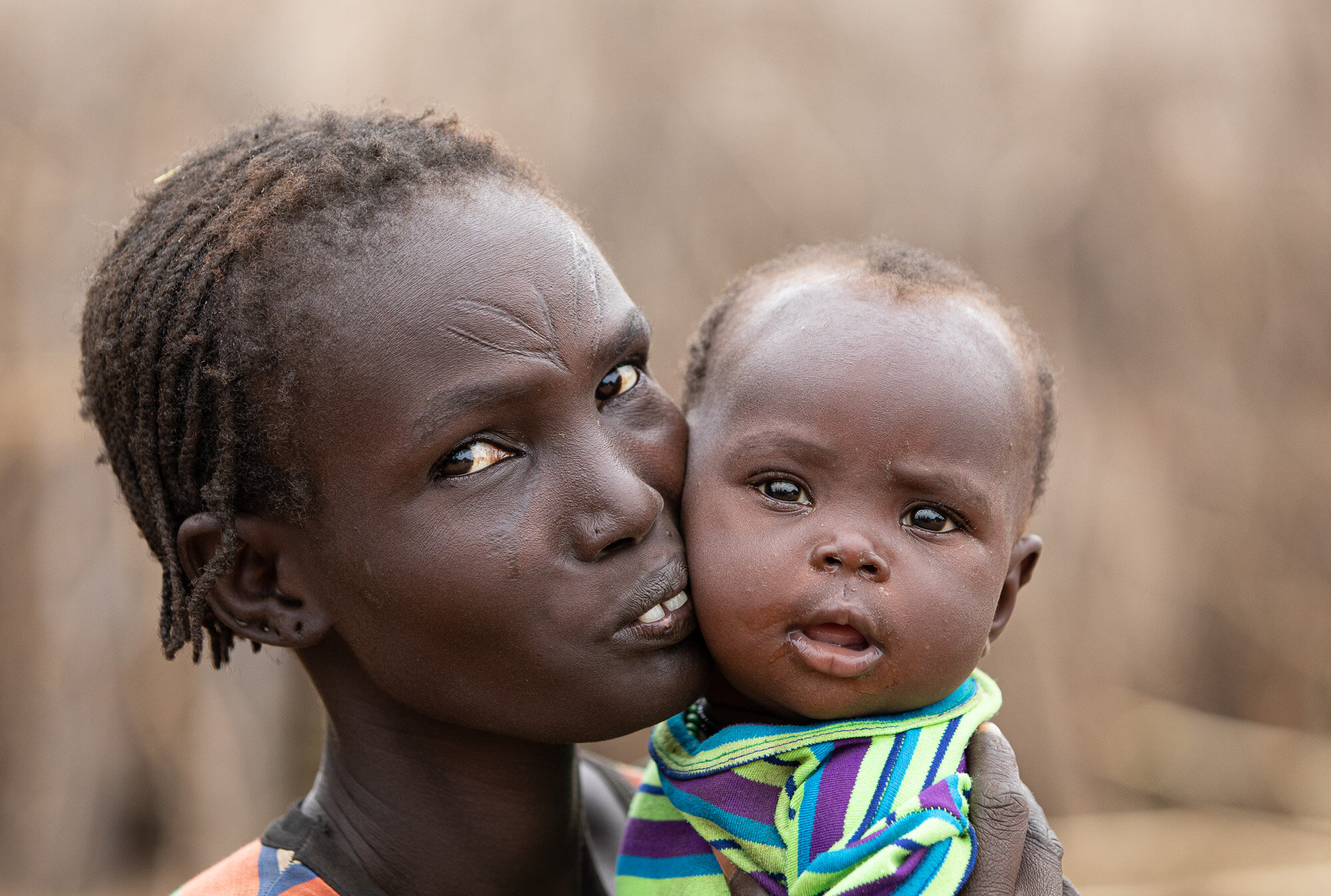 Nyangatom tribe mum and baby Omo Valley tours ethiopia