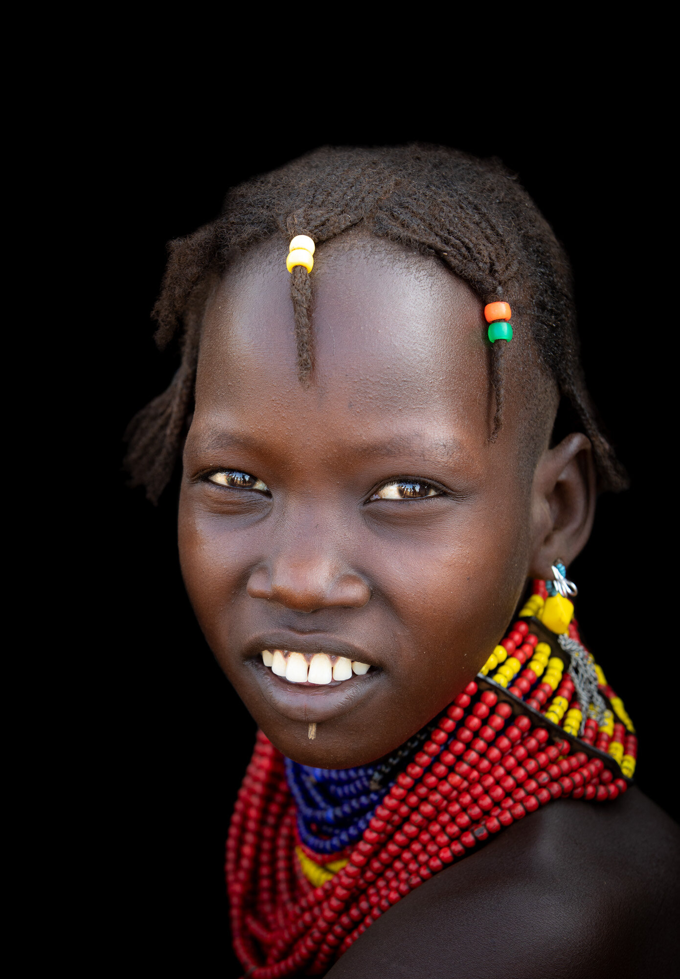 Dassanech tribe girl portrait from Ethiopia Omo Valley tribe tour