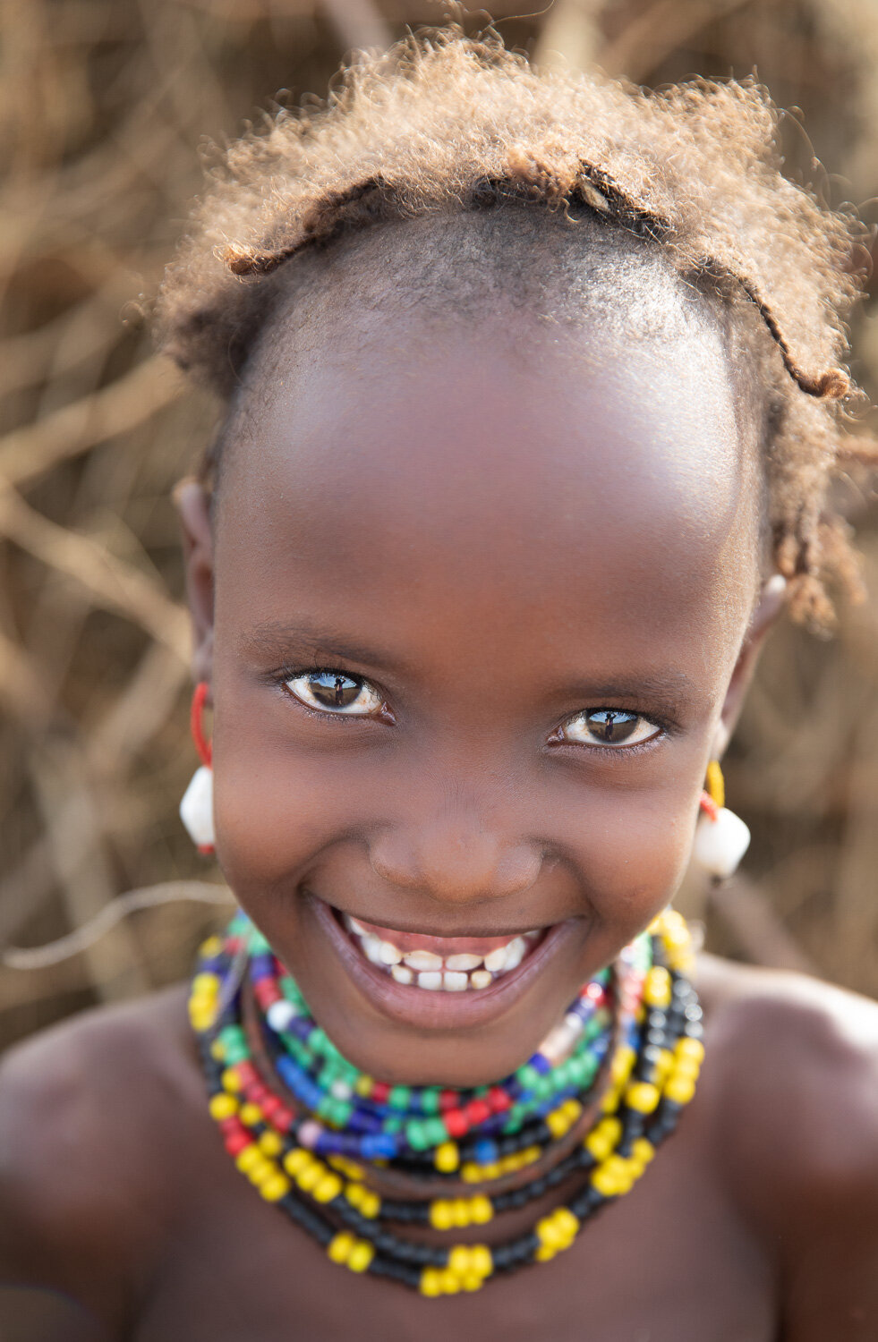 Dassanech tribe girl portrait from Ethiopia Omo Valley tribe tour
