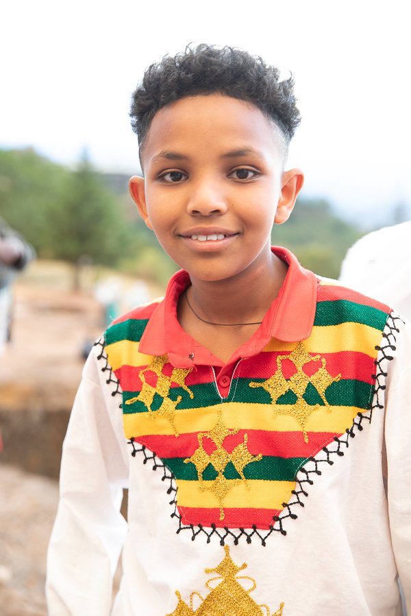 portrait of boy in traditional Ethiopian clothes in Lalibela
