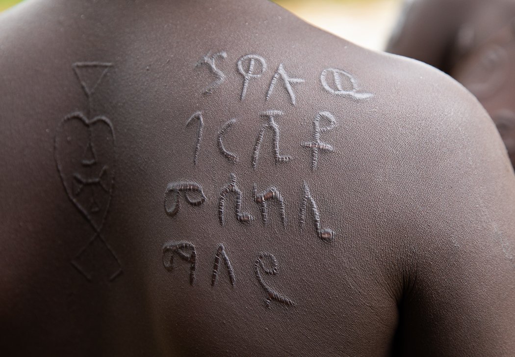 Mursi tribe Omo Valley tribal portrait body scarring on photo tour