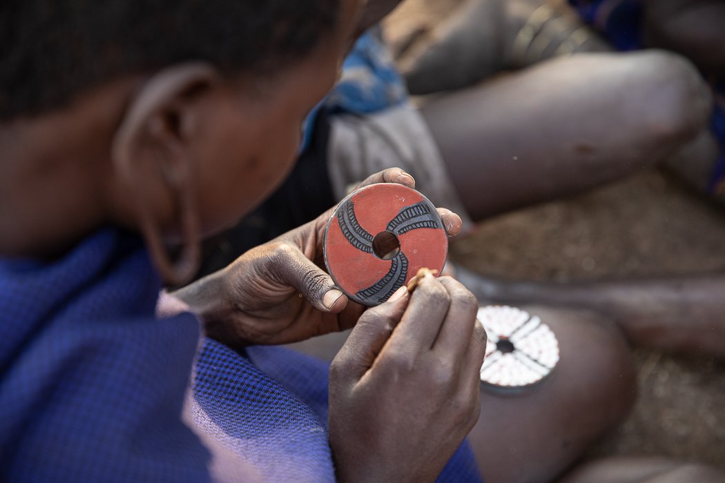 hand painted lip plates by women in Mursi tribe 