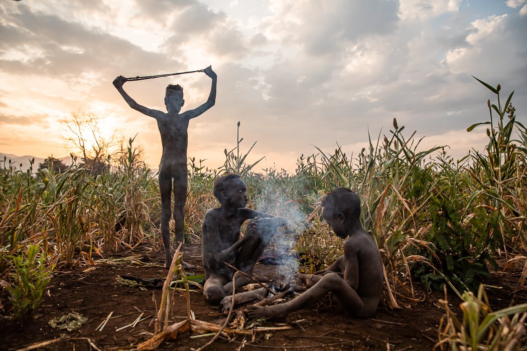 boys from mursi tribe on Omo Valley photography tour with jayne mclean